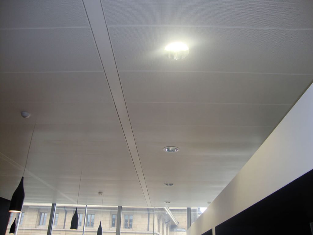This is a white false ceiling installed in a large room.